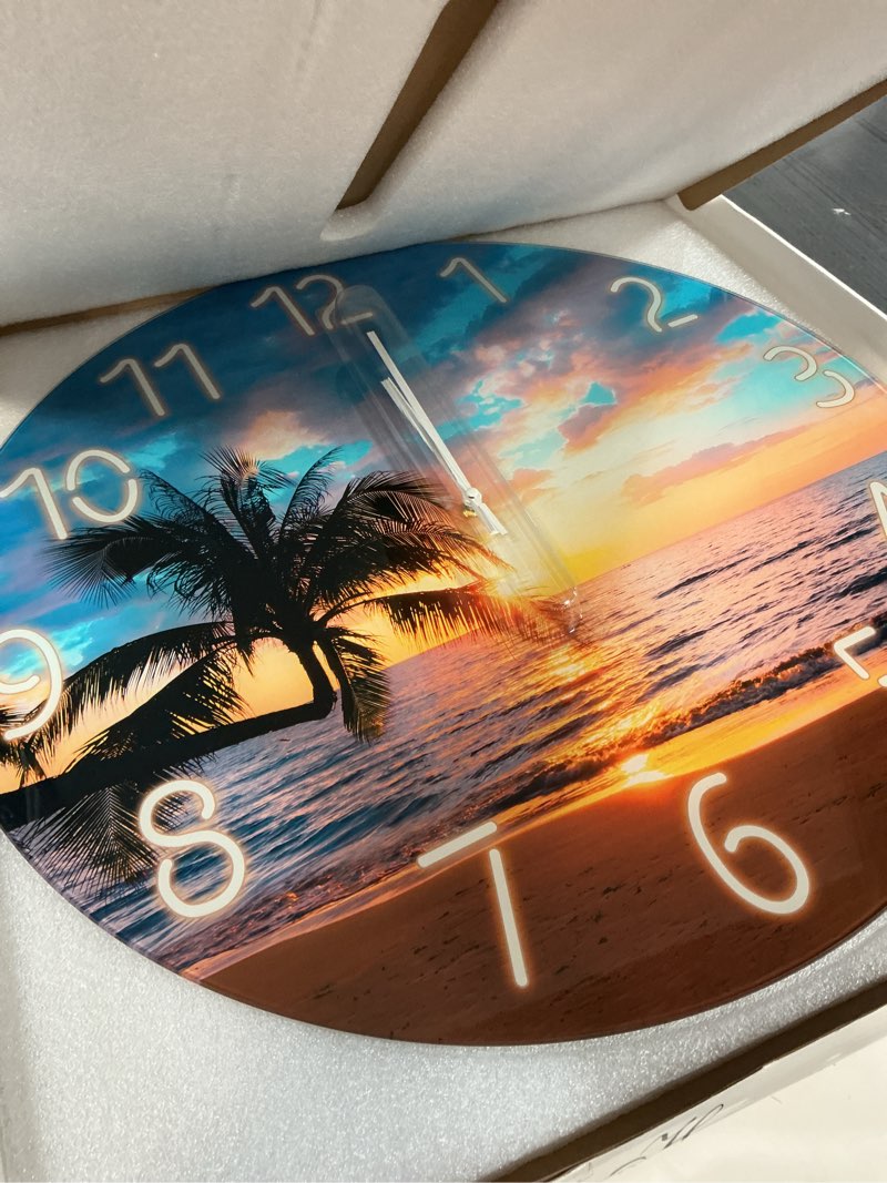 Condition photo showing As Is for XFM Large Beach Wall Clock 24 Inch Palm Tree Silent Wall Clocks Battery Operated Sunset Glass Coastal Wall Clock for Living Room Bedroom Kitchen Office 24 Inch Blue2
