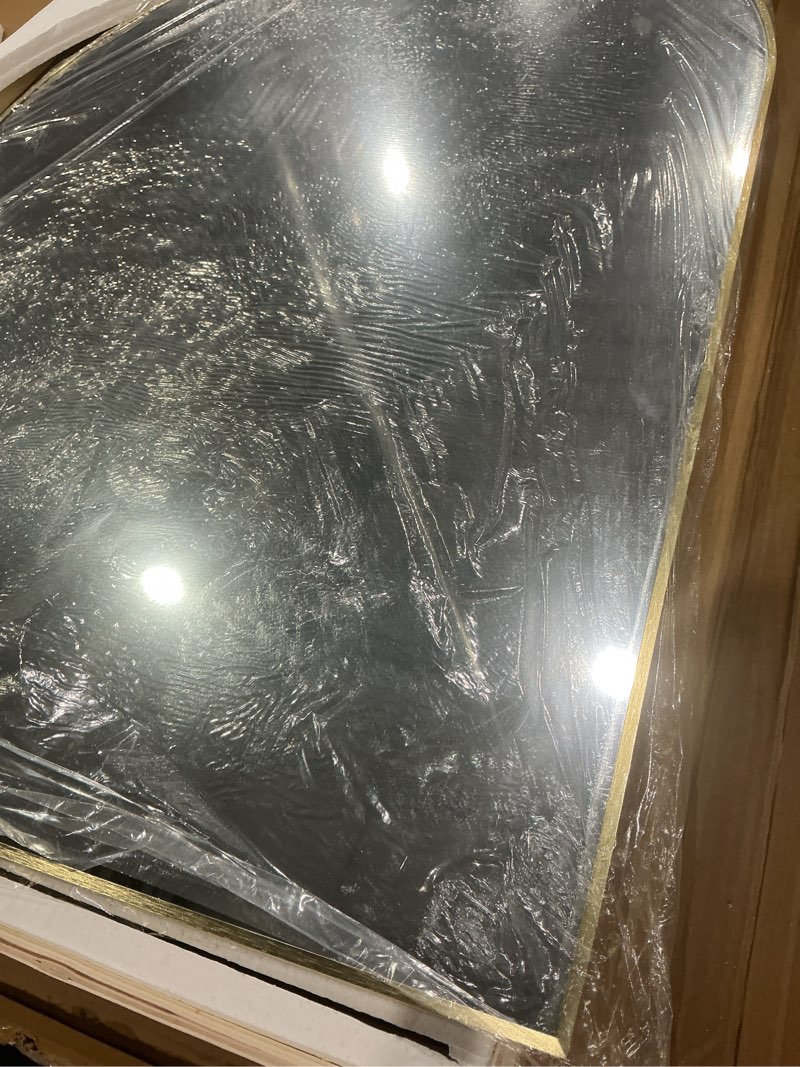 Condition photo showing As Is for wall mounted mirror,color gold.