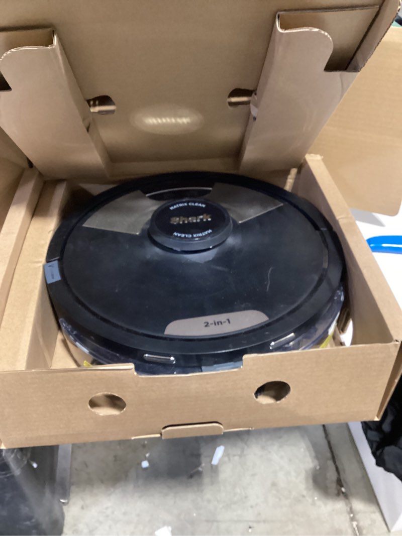 Condition photo showing As Is for Shark Matrix Plus Robot Vacuum and Mop with Self-Empty HEPA Base, Sonic Mopping, Matrix Clean, Home Mapping, HEPA Bagless Self Empty Base, CleanEdge, for Pet Hair, UR2650WS Wet and Dry Self-Empty (Black)