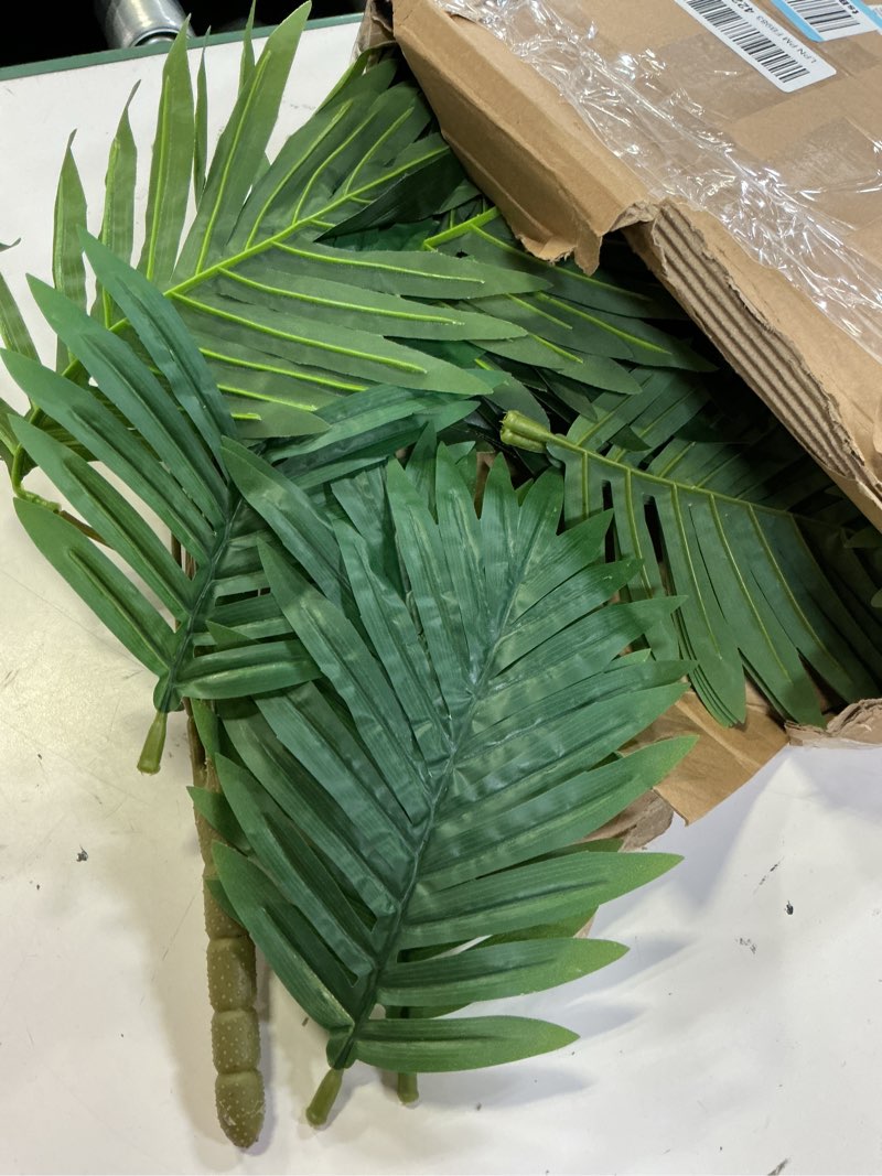 Condition photo showing Good Condition for tigeen 4 pcs artificial palm leaves tree 33 inch fake tropical plant with stems large faux palm leaf bush greenery for hawaiian luau, jungle safari, pool beach party, wedding, garden, indoor outdoor