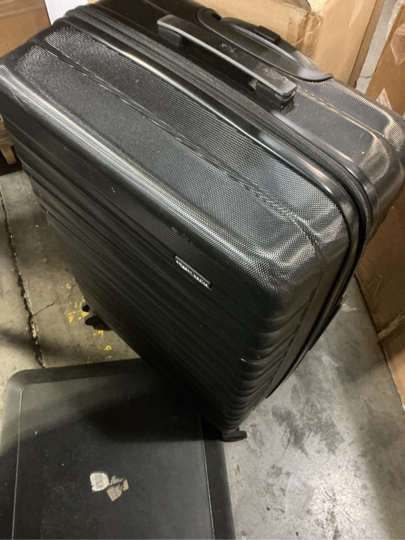 Condition photo showing Good Condition for amazon basics 30" hardside large checked luggage, hardshell suitcase with wheels, expandable for up to 15% more space, with scratch-resistant surface, four multi-directional wheels, black black large checked