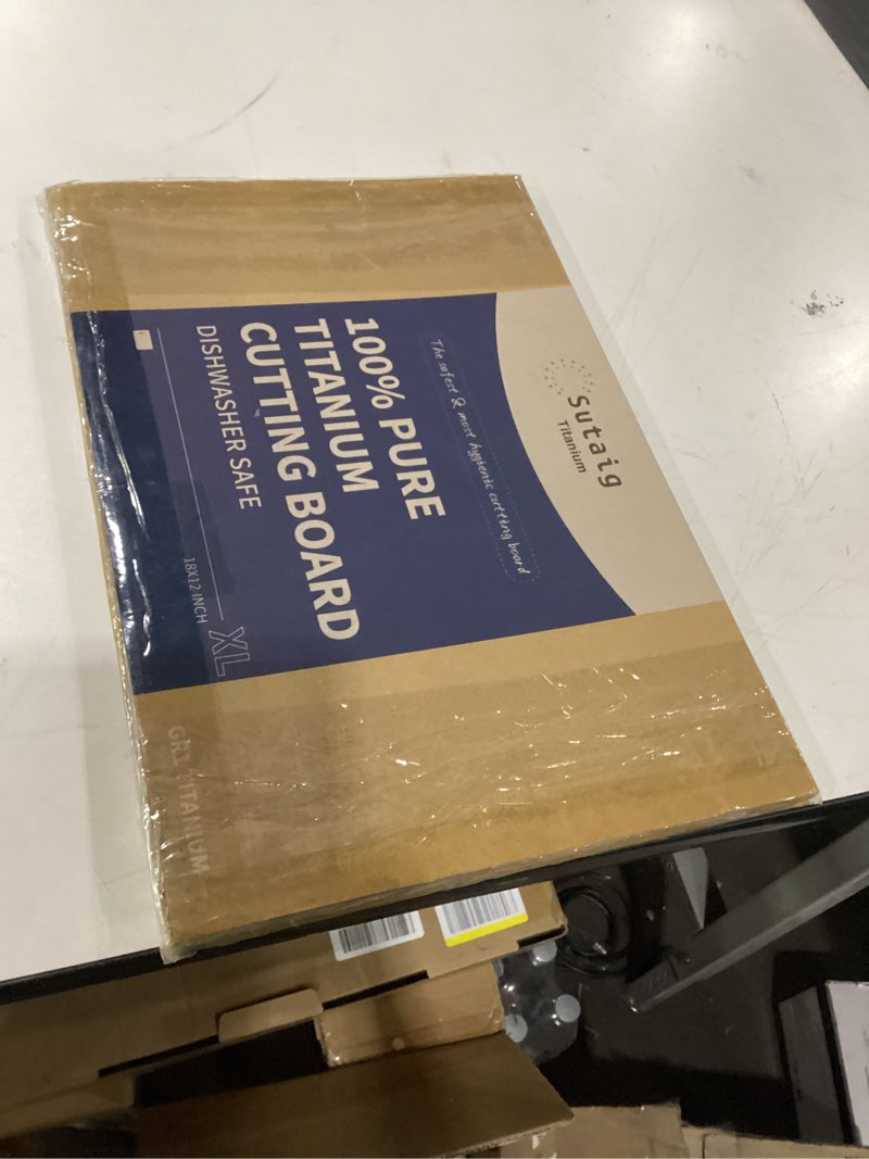 Condition photo showing New/Like New for Titanium cutting board 