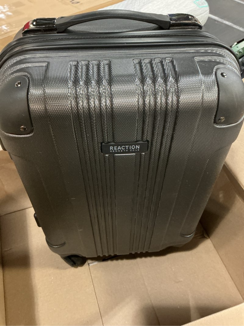 Condition photo showing Good Condition for Kenneth Cole REACTION Out of Bounds Lightweight Hardshell 4-Wheel Spinner Luggage, Charcoal, 20-Inch Carry On 20-Inch Carry On Charcoal
