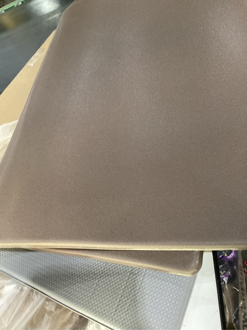 cushioned anti-fatigue kitchen mat designed for comfort while standing. it typically features a waterproof, oil-resistant surface and a non-slip backing for safety