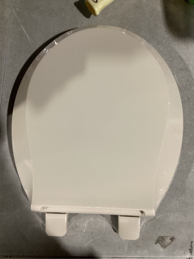 Condition photo showing New/Like New for KOHLER 4639-RL-47 Cachet ReadyLatch Quiet-Close Round Toilet Seat, Slow Close Lid and Seat, Grip-Tight Bumpers and Installation Hardware, Almond