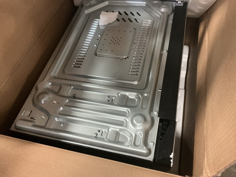 Condition photo showing As Is for Frigidaire EMW112OAMZ Stainless Steel Microwave Oven, Multi Function, Programmable, 1.1 Cu Ft 1000-Watt, residential kitchen, Stainless