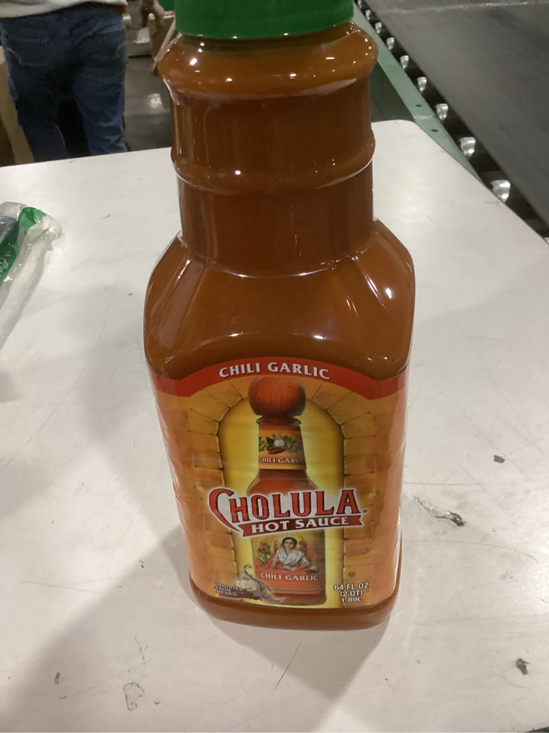 Condition photo showing New/Like New for Cholula Chili Garlic Hot Sauce, 64 fl oz - One 64 Fluid Ounce Bulk Container of Chili Garlic Hot Sauce with Mexican Peppers, Garlic and Signature Spices, Perfect for Eggs, Wings, Fries and Popcorn