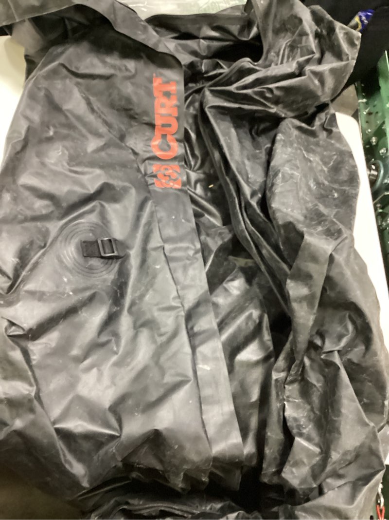 Condition photo showing As Is for curt 18211 56 x 22 x 21-inch weather-resistant black vinyl cargo bag for hitch carrier
