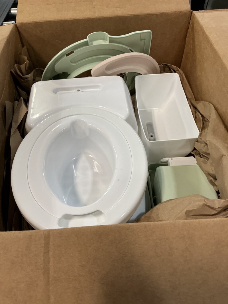 Condition photo showing As Is for real feel 2-in-1 potty with wipes storage, flushing sounds & disposable liners - realistic toilet - easy to clean & assemble - jool baby (sage)