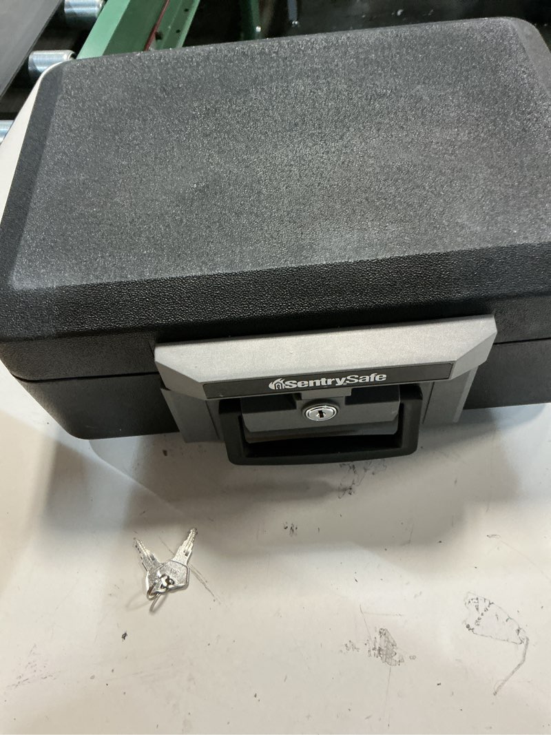 Condition photo showing Good Condition for SentrySafe Fireproof Safe Box with Key Lock, Chest Safe with Carrying Handle to Secure Money, Jewelry, Documents, 0.25 Cubic Feet, 6.3 x 15.3 x 12.1 Inches, 1160 Fire resistant box 0.25 cu. ft.