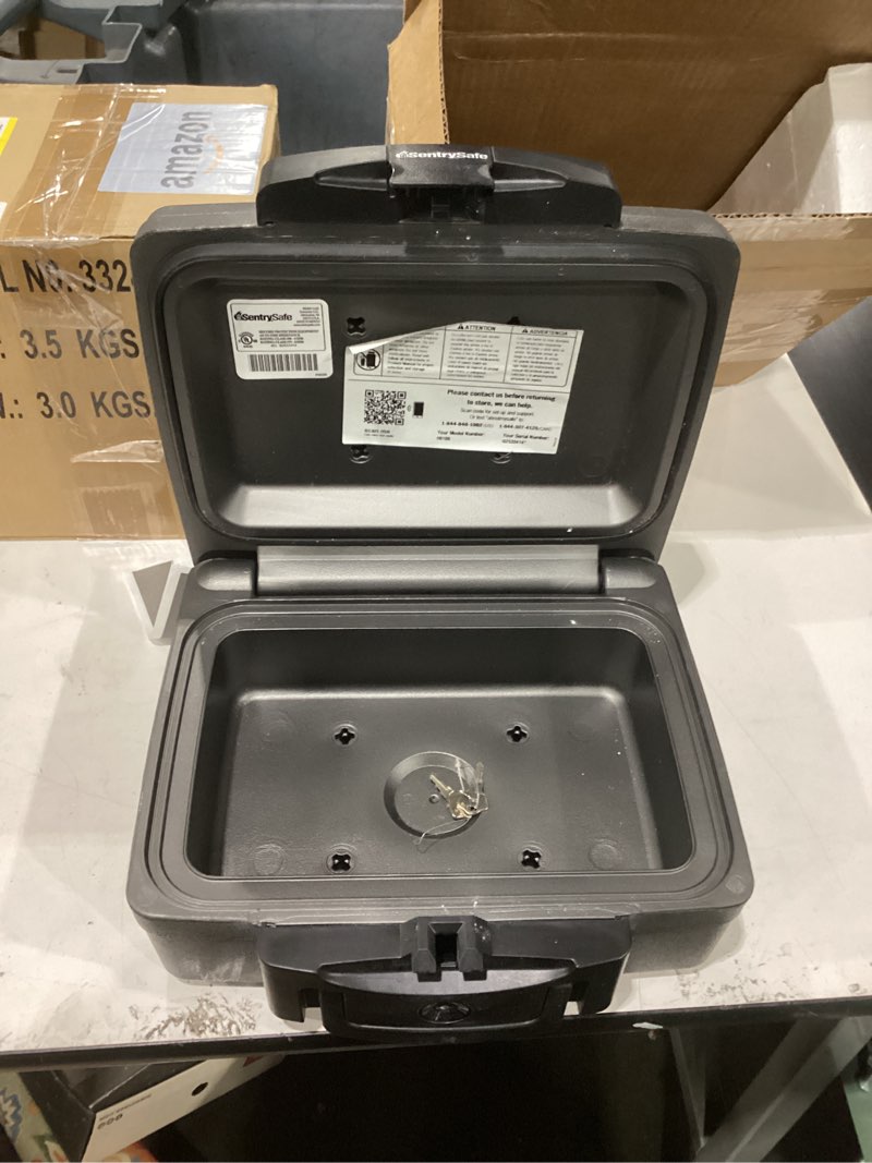 Condition photo showing Good Condition for SentrySafe Fireproof and Waterproof Safe, Black Portable Lock Box with Key Lock and Carrying Handle for Money, Passport, Exterior: 14.3 in W x 13 in D x 6.1 in H, ?H0100