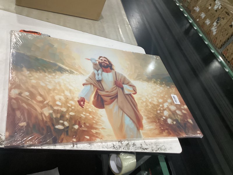 Condition photo showing New/Like New for jesus and lamb canvas wall art jesus saves the lost lamb wall decor pictures walking among flowers painting posters prints for dining living room kitchen wall bedroom decoration(24l x 36w)