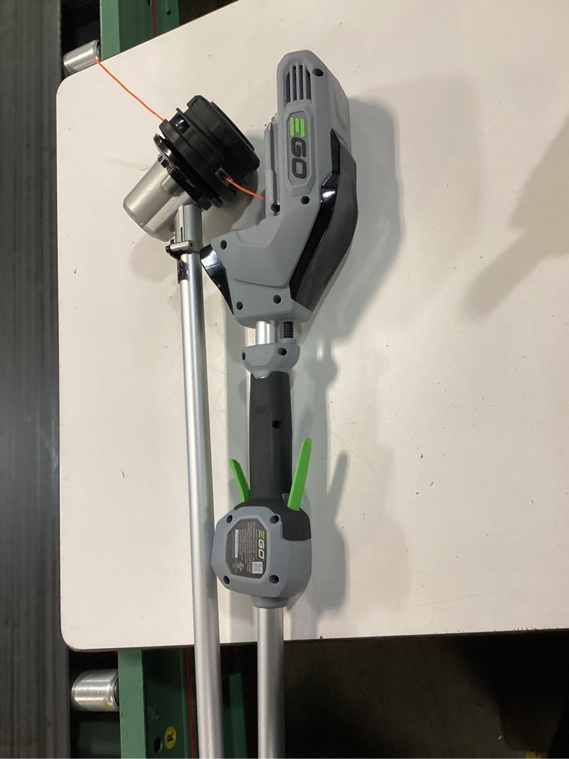 Condition photo showing As Is for ego power+ st1502sa 15 in. 56 v battery string trimmer kit (battery & charger) split shaft w/ rapid reload & 2.5 ah battery