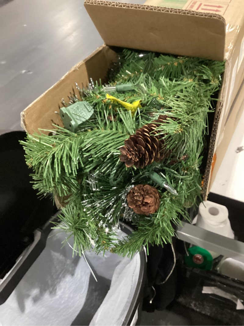 Condition photo showing Good Condition for national tree company 9 ft pre-lit crestwood spruce artificial christmas garland, christmas decoration with glitter, pinecones, red berries, 50 clear lights, 180 tips, green plug in tree