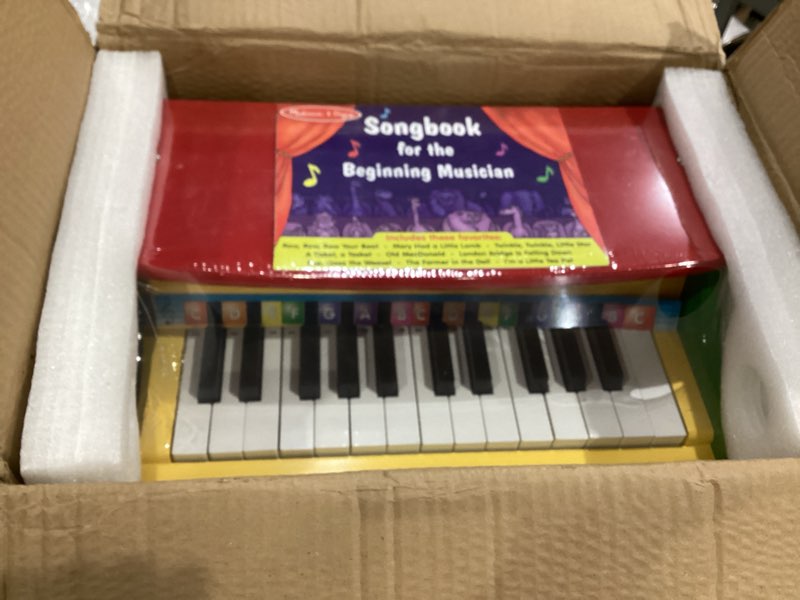 Condition photo showing New/Like New for melissa & doug learn-to-play piano with 25 keys and color-coded songbook toy piano kids, toddler toys for ages 3+