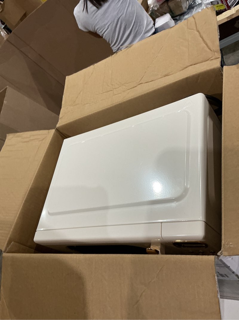 Condition photo showing As Is for mainstays 0.7 cu ft retro countertop microwave oven , 700 watts, vanilla dream, new