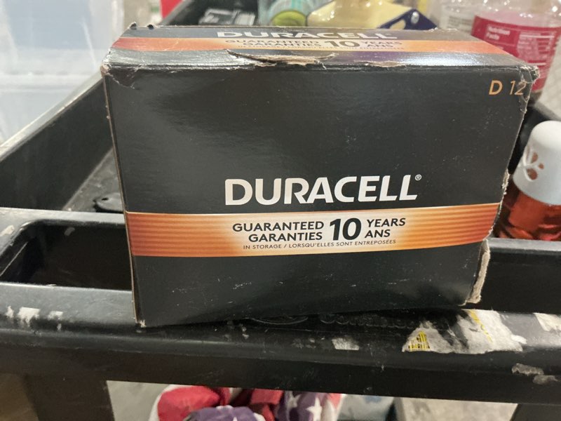 Condition photo showing As Is for duracell® coppertop d alkaline batteries, box of 12