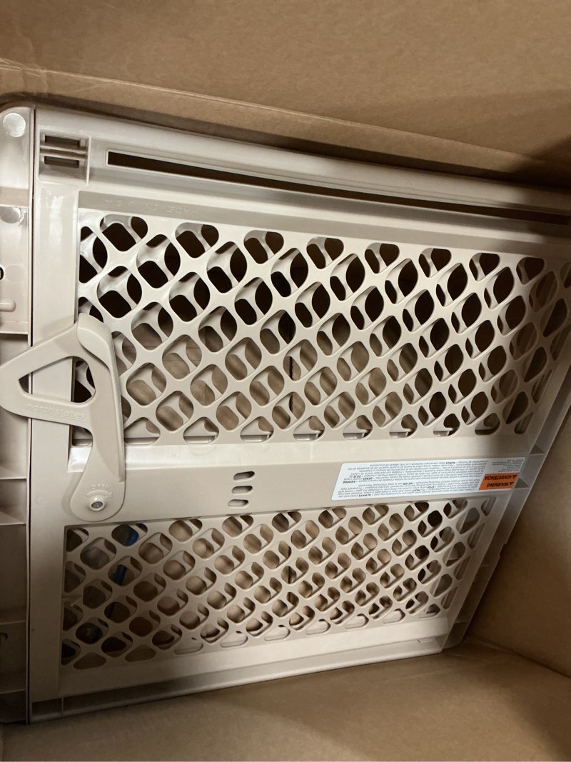 Condition photo showing As Is for Toddleroo by North States - Supergate Ergo Baby Gate: Plastic Baby Gate for Stairs & Doorways - Adjustable Indoor Safety Gate - Made in USA - 26 to 42 Inches Wide - 26 Inches Tall - Sand