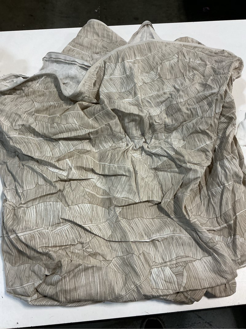 Condition photo showing As Is for home leaves 2 piece twin/twin xl duvet set