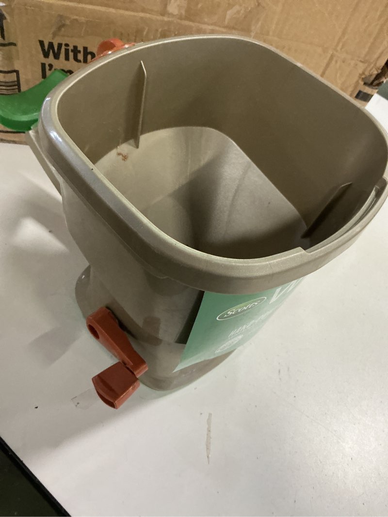 Condition photo showing As Is for Scotts Whirl Hand-Powered Spreader for Grass Seed, Fertilizer, Salt, Ice Melt, Handheld Spreader Holds up to 1,500 sq. ft. Product