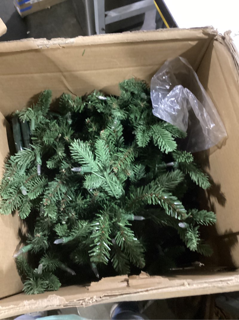 Condition photo showing As Is for National Tree Company 6.5 ft Pre-Lit Tiffany Fir Slim Artificial Christmas Tree, 500 Clear Lights, 1,462 Tips, Includes Stand, Green 6ft 6in Tree