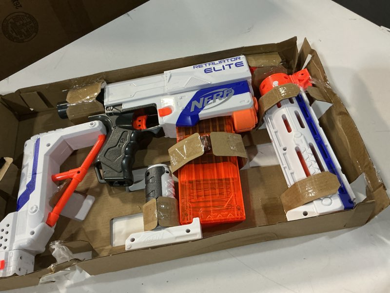 Condition photo showing New/Like New for NERF N-Strike Elite Retaliator Blaster, Stock, Grip, Barrel, 12-Clip, 12 Darts, Outdoor Toys for Kids 8+ (Amazon Exclusive)