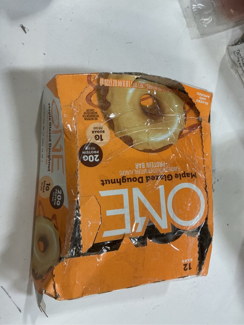 Condition photo showing New/Like New for BB: 10 2026 ONE Protein Bars, Maple Glazed Doughnut, Gluten Free with 20g Protein and 1g Sugar, Pantry Staples, 2.12 oz (12 Count)