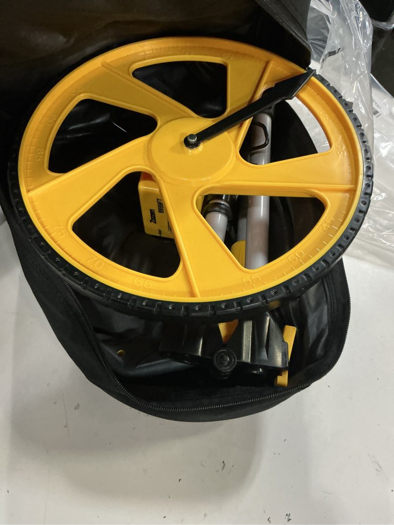 Condition photo showing Good Condition for zozen measuring wheel in feet and inches, mechanical/double collapsible/one key to reset/kickstand to keep stand/starting point arrow and cloth carrying bag, 0-9,999 ft measure wheel. 12inch