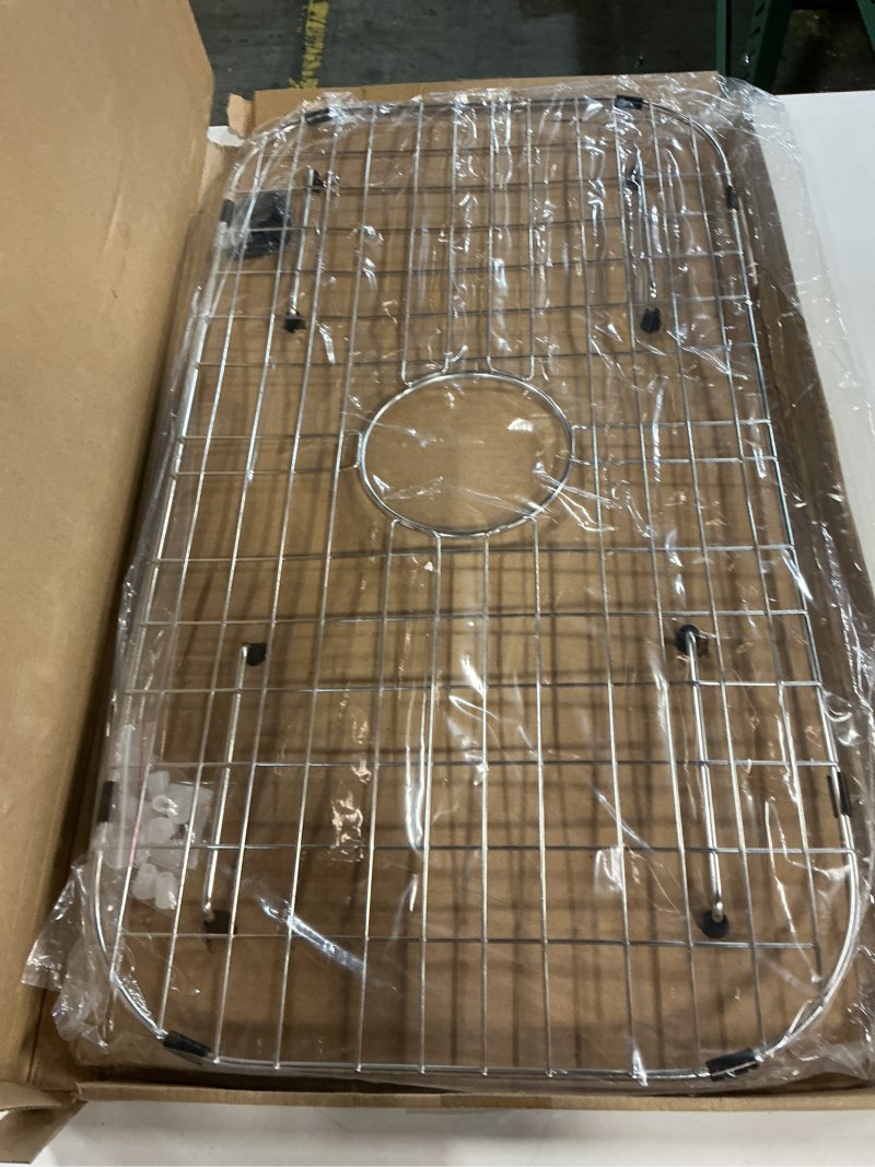 Condition photo showing New/Like New for sink protector grid 26-1/16" x 14-1/16", centered drain with corner radius 3-1/2", 304 stainless steel material (centered drain) 26-1/16" x 14-1/16" centered drain