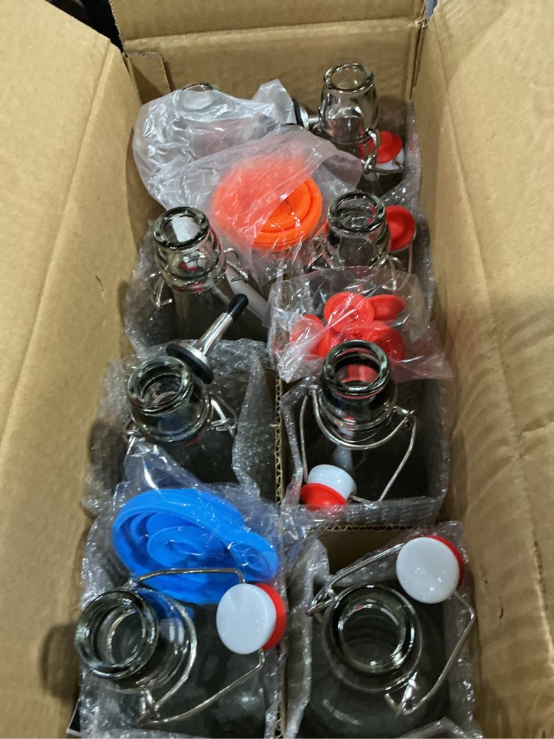 Condition photo showing Good Condition for 8 pack [1 l / 33 fl. oz.] swing top glass bottles w/ airtight stopper lids – flip top brewing bottle for fermentation, kombucha, mead, vinegar, beer, kefir, wine, soda – with 8 extra seals & 2 pourer