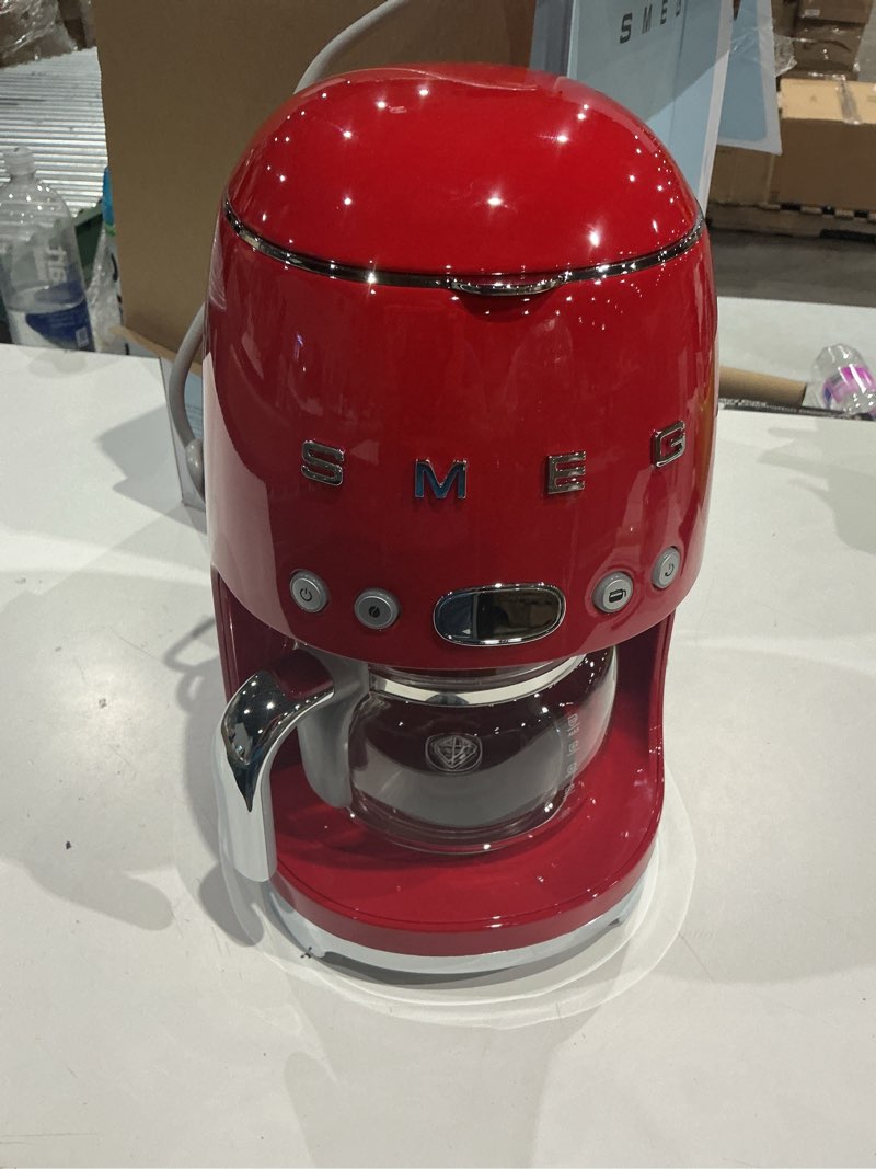 Condition photo showing Good Condition for smeg 50's retro style aesthetic drip coffee machine with 10 cup glass carafe, auto start feature, keep warm plate, and two coffee strength settings (red) 10 cup red
