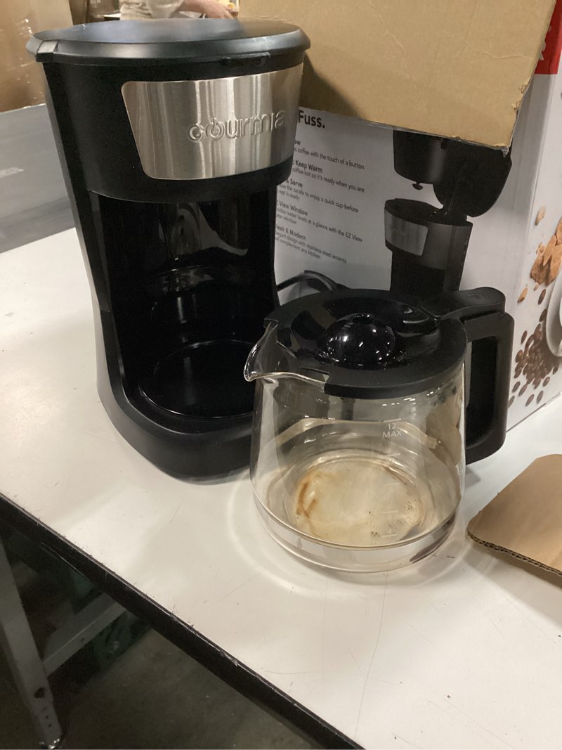 Condition photo showing As Is for Gourmia 12 Cup One-Touch Coffee Maker – Pause and Serve with Automatic Keep Warm, Easy View Water Window, Compact Design, Stainless Steel Accents, Black