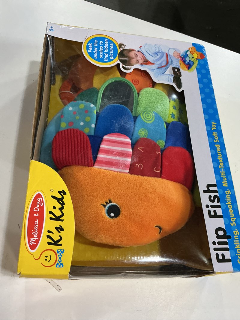 Condition photo showing New/Like New for Melissa & Doug K’s Kids, Flip Fish Stuffed Animal, Soft Baby Book, Multi-Textured Squeaking & Crinkling Infant Sensory Toys for Babies with Baby Mirror, Tummy Time Toys for Infants Ages 0–9 Months