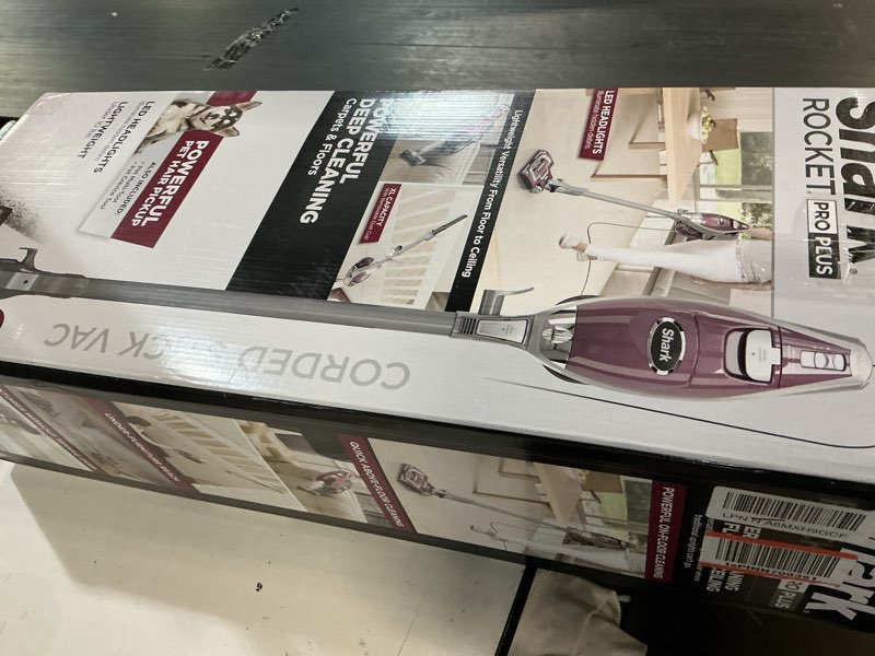 Condition photo showing As Is for shark hv322 rocket pet plus corded stick vacuum with led headlights, xl dust cup, lightweight, perfect for pet hair pickup, converts to a hand vacuum, with (2) pet attachments, bordeaux/silver rocket deluxe w/ headlights