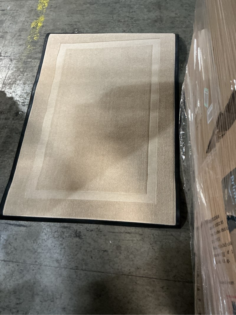 Condition photo showing item condition for Beige door mat with rubber backing 32” x 46” (similar to stock photo)