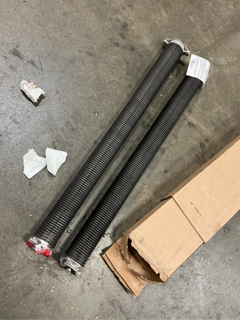 Condition photo showing As Is for svopes garage door garage door torsion springs black steel torsion spring