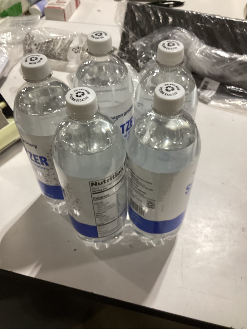Condition photo showing New/Like New for 5 pack Amazon Grocery, Seltzer Sparkling Water, 33.8 Fl Oz (Previously Happy Belly, Packaging May Vary) 33.8 Fl Oz (Pack of 5
