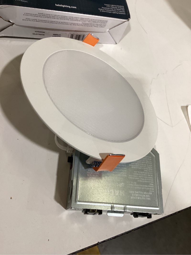Condition photo showing As Is for halo hlbls series white 6-in 1100 -lumens switchable white round dimmable led canless wet rated recessed downlight