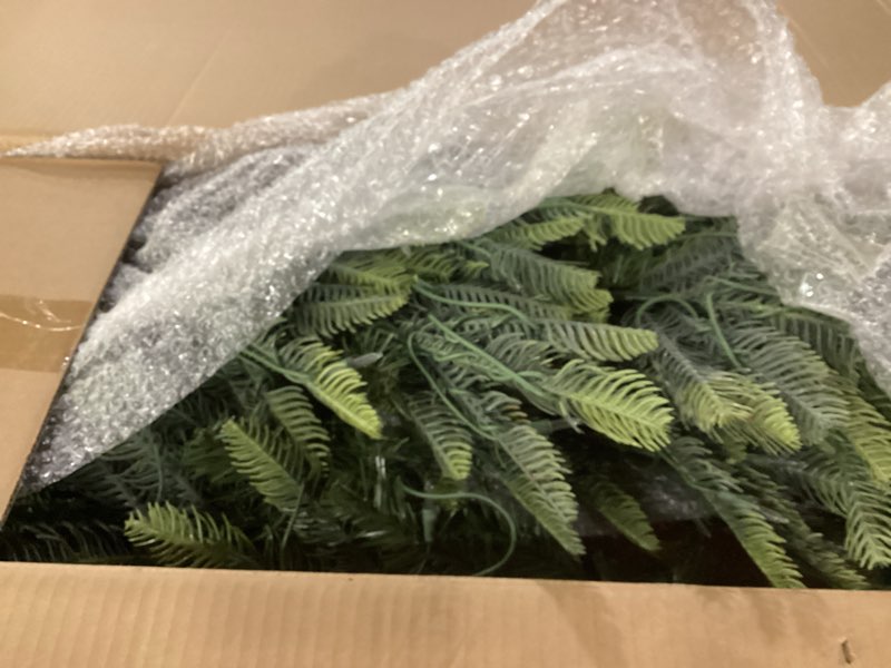 Condition photo showing As Is for Puleo International 6.5 Foot Pre-Lit Aspen Fir Artificial Christmas Tree with 500 UL Listed Clear Lights, Green 6.5' Aspen Fir with 500 Clear Lights