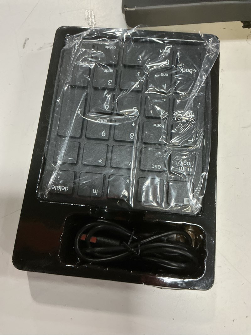 Condition photo showing New/Like New for havit bluetooth number pad wireless numeric keypad numpad 26 keys portable mini financial accounting rechargeable numeric pad for windows laptop desktop, pc, notebook (black)