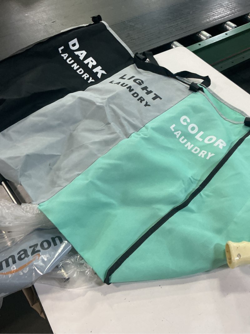 Condition photo showing As Is for 135L Laundry Cloth Hamper Sorter Basket Bin Foldable 3 Sections with Aluminum Frame 26''×24''H Washing Storage Dirty Clothes Bag for Bathroom Bedroom Home Storage basket (3 Liner, Green+grey+black)