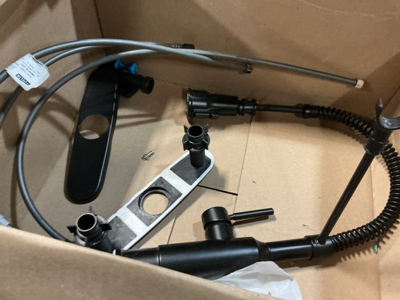 Condition photo showing As Is for commercial style spring matte black 19.01 in. h 2-func pull-down brass faucet w/ 360° swivel