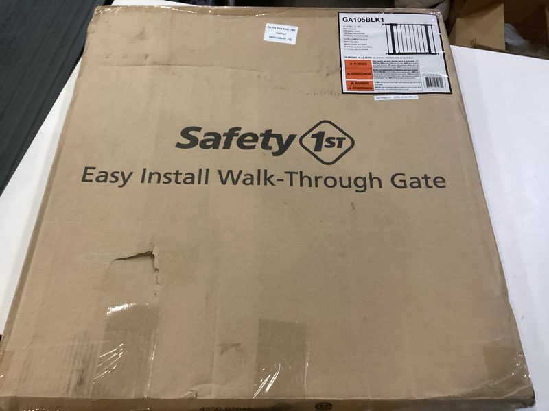Condition photo showing New/Like New for safety 1st easy install 28'' walk thru gate, fits between 29'' and 38'', black, 1-pack,(ga105cblk) 1-pack 29" to 38" wide x 28" tall black
