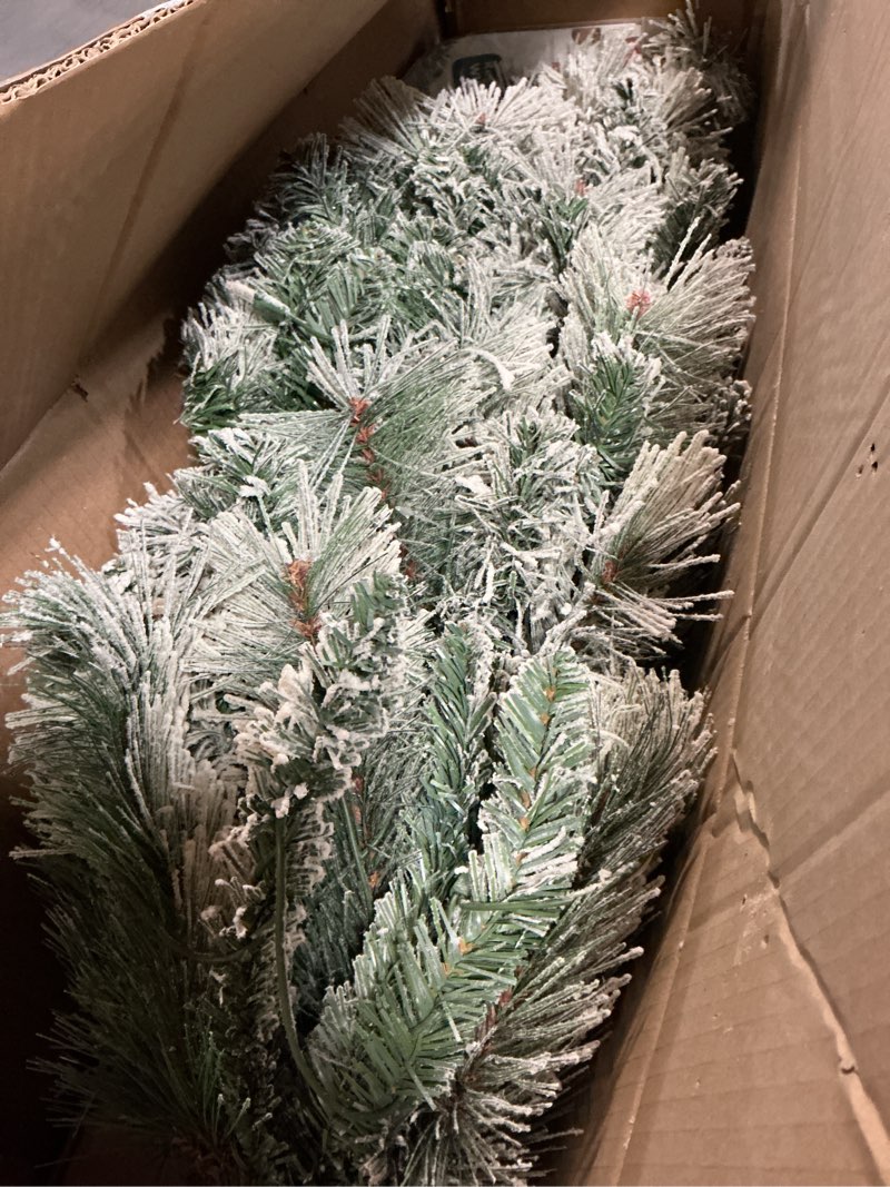 Condition photo showing Good Condition for Puleo International 4.5ft Pre-Lit Flocked Portland Pine Pencil Christmas Tree with 100 Clear Lights, 195 Realistic Dense Snow Flocked Branch Tips, Easy Setup Artificial Trees with Sturdy Metal Stand 4.5' Flocked Portland Pine 100 Clear Lights