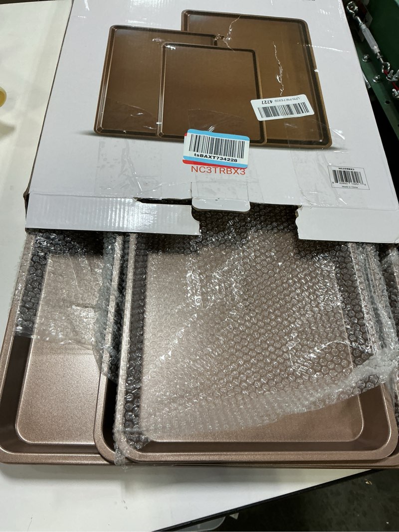 Condition photo showing Good Condition for NutriChef 3-Piece Nonstick Baking Pans Set - Thick Carbon Steel Oven Bake Trays - Includes XL, Medium, & Small Sizes - Versatile Cookie Sheets for Baking & Roasting, Dishwasher Safe - Gold