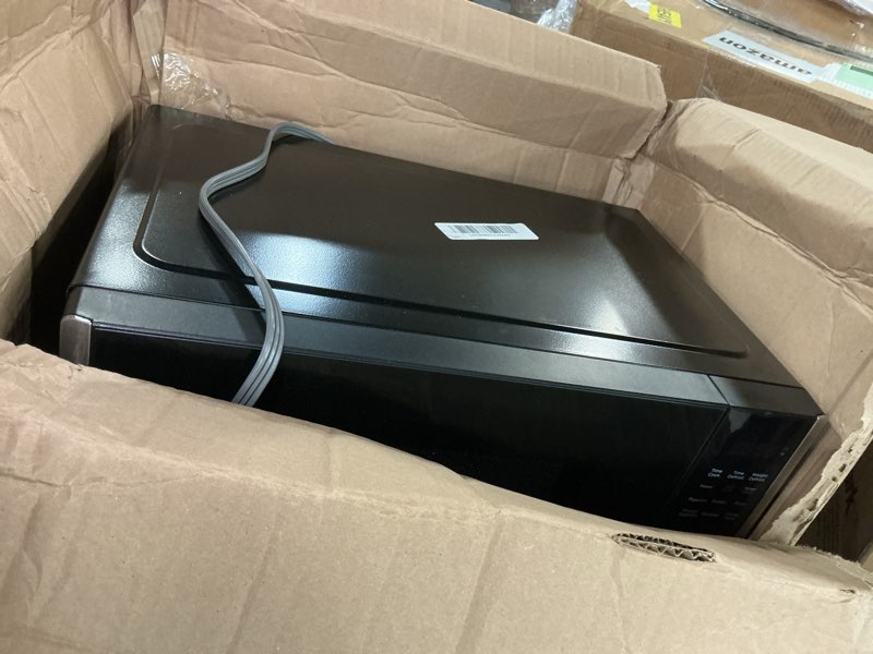 Condition photo showing As Is for BLACK+DECKER Digital Microwave Oven with Turntable Push-Button Door, Child Safety Lock, Stainless Steel, 0.9 Cu Ft 0.9 Cu.Ft