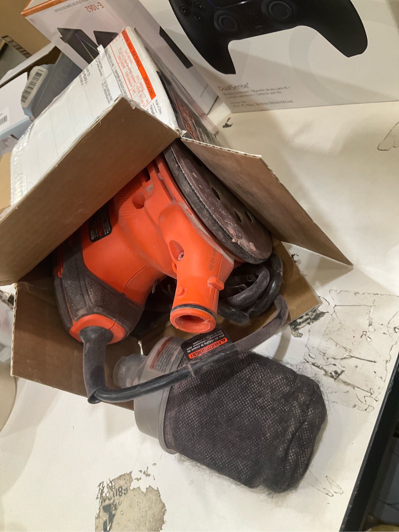 Condition photo showing As Is for black+decker orbital sander, 5 inch, 2.0 amp, 12000 opm, corded, 1 sandpaper sheet and dust bag included (bdero100) sander only