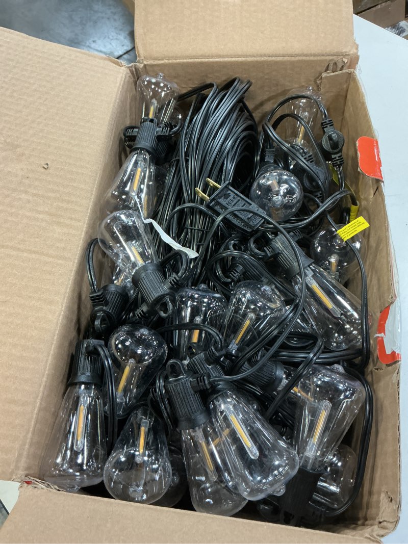 Condition photo showing Good Condition for ZOTOYI Outdoor String Lights 150 FT, Waterproof IP65 Outdoor Lights for Patio with 76 Edison ST38 LED Bulbs(3 Spare), Plastic LED String Lights for Outside, Bistro, Cafe, Backyard, Garden 2700K 150FT