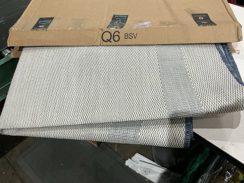 Condition photo showing As Is for similar to not exact outdoor rug, large modern outside rugs for patios porches waterproof durable washable non-shedding, easy-to-clean indoor outdoor area carpet (blue/white)