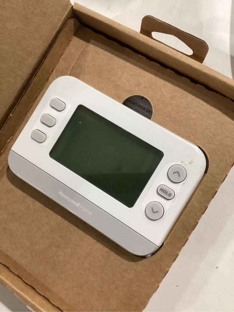 Condition photo showing As Is for X2P Programmable Thermostat, Conventional/Heat Pump, Flexible Schedule